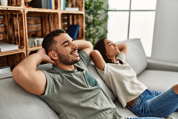 couple resting in living room comfortably